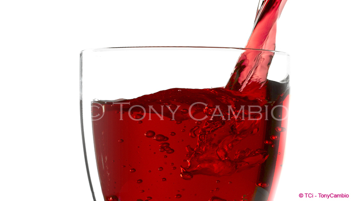 A glass of Wine being poured